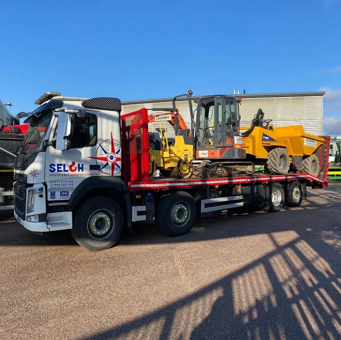 lorry with digger on the back